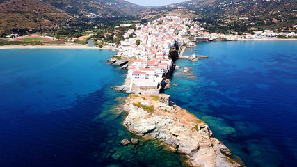 Aerial drone bird's eye view of iconic and picturesque Andros island chora, Cyclades, Greece