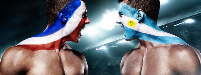 Soccer or football fan with bodyart on face with agression - flag of France vs Argentina.