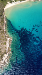 Aerial drone bird's eye view photo of famous turquoise water sandy beach of Psili Amos near port of Gavrio, Andros island, Cyclades, Greece