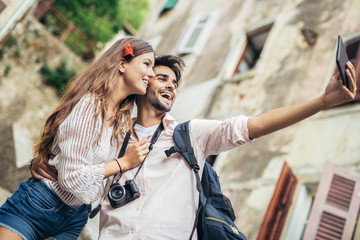 Romantic tourist couple using digital tablet computer