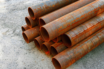 Iron pipes covered with rust in stack