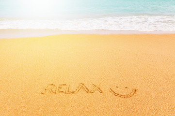 Beautiful bright sandy beach by the blue sea. Inscription 
