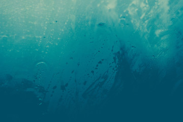 Fototapeta na wymiar misted glass. Water on the car glass. beautiful desktop, blue, background.