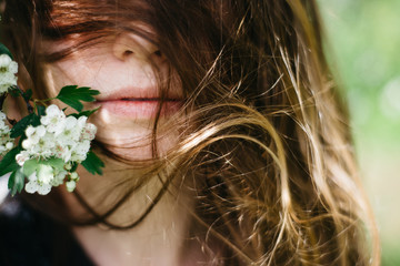 Naklejka premium Portrait of a girl with flowers.