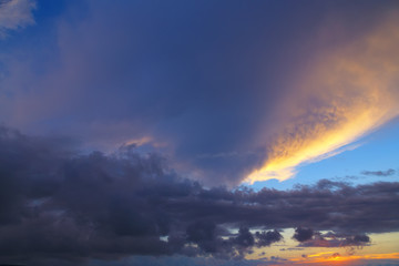 Evening Sky,Colorful Dark Blue and Amazing Dramatic Sunset sky on twilight with Storm Cloud,majestic fantastic sky nature background,idyllic sunlight on cloud fluffy,well use as background.