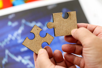 Closeup hand  connecting jigsaw puzzle,Business solutions, success and strategy concept
