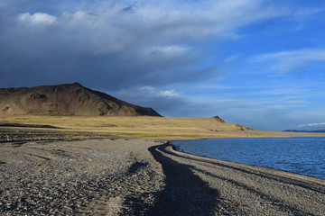 Western Tibet. Sacred lake Dangra (Dang Ra Gyu Tso) in summer evening in cloudy weather