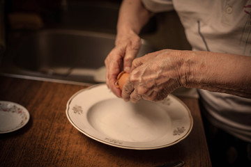 Hands grandmother prepare dough.