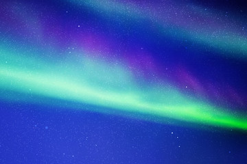 Obraz na płótnie Canvas Night starry sky. Northern lights. Dark blue green aurora borealis
