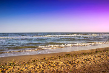 beautiful yellow sandy beach near the blue sea