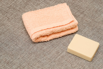 Soap and towel. Shower accessories. Hygiene items.