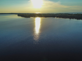 Gulf and island view from the height, the sea and the forest at sunset