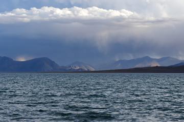Western Tibet. Sacred lake Dangra (Dang Ra Gyu Tso) in summer evening in cloudy weather