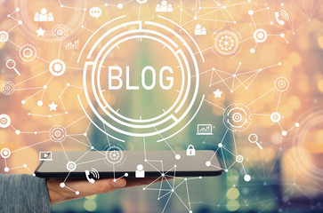 Blog with man holding a tablet computer