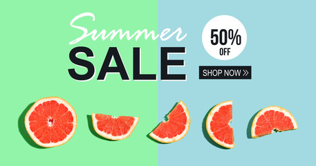 Summer sale message with halved fresh grapefruits