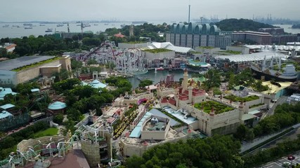 Drone shot of roller coaster and other attractions in Sentosa island theme park in Singapore