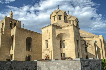 Fototapeta na wymiar Side view of the corner windows and the bell tower of Cathedral St. Gregory Illuminator, along the street of Yervand Kochar in the capital of Armenia Yerevan