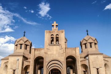 Fototapeta na wymiar View of the main entrance and bell tower of the Cathedral of Grigor Illuminator from Tigran Metz street in Yerevan, the capital of Armenia
