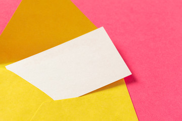 Paper envelopes on a colored pink background