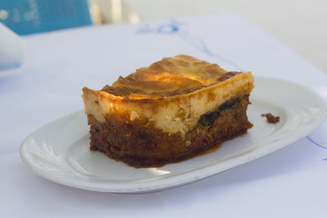 Greek traditional moussaka with a crusty bechamel on the top at seaside
