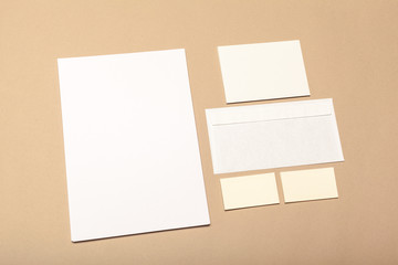 Blank paper pieces for mock up on a beige background