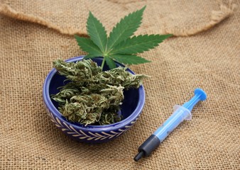 Phoenix tears or hash oil in syringe, medical marijuana concept.