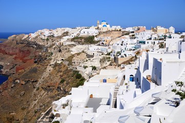 Naklejka premium Famous stunning view of white architectures and colors above the volcanic caldera in the village of Oia in Santorini island, Greece