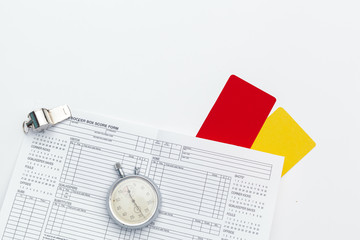 two penalty cards and a whistle for the referee