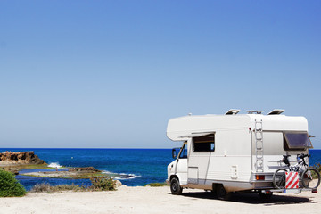 House on the wheels / Camper van on the seaside, travel in vacation