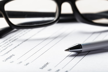 Close up shot of Eyeglasses  on document papers business concept