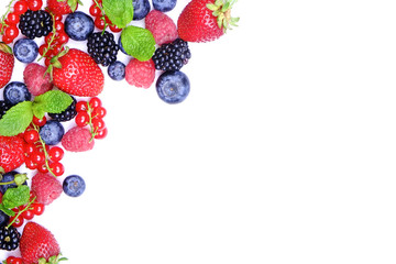 Bunch of mixed berries in harvest pile on white background. Colorful composition with fresh organic strawberry, blueberry, blackberry & redcurrant. Clean eating concept. Close up, copy space, top view