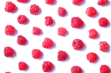 Bunch of fresh organic raspberry berries in seamless ornament pattern, white background. Clean eating concept. Healthy nutritious vegan snack, tasty raw diet. Close up, copy space, top view, flat lay.
