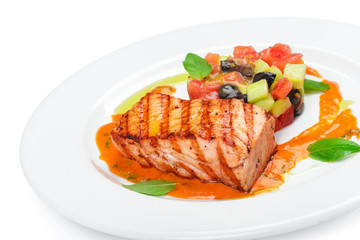 Grilled salmon fillet isolated on white.