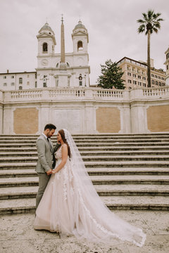 Fototapeta Young wedding couple on Spanish stairs in Rome