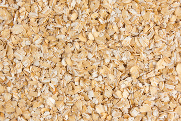 Oat flakes background, backdrop or texture