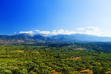 Fototapeta na wymiar Green hills and mountains on the Greek island of Crete in Chania region on beautiful sunny day