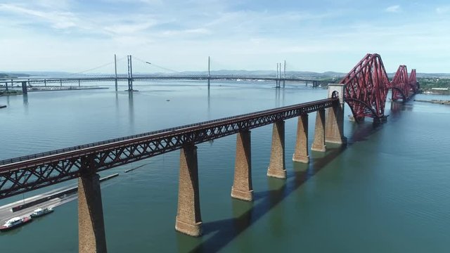 4K aerial footage of the iconic Victorian cantilever railway bridge across the Firth of Forth near Edinburgh.