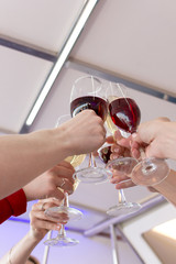 Glasses of wine in the women`s hands.