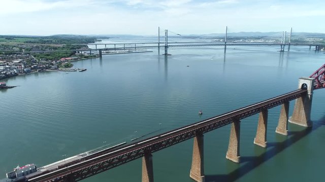 4K aerial footage of the iconic Victorian cantilever railway bridge across the Firth of Forth near Edinburgh.