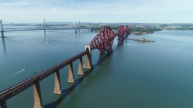 4K aerial footage of the iconic Victorian cantilever railway bridge across the Firth of Forth near Edinburgh.