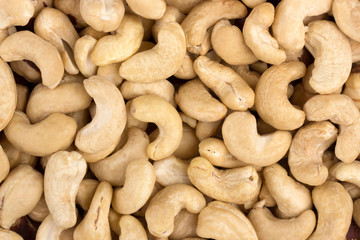 fried cashew nuts close-up, top view, cashew background