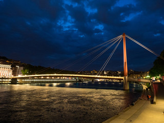 FRANCE - Illuminated footbridge Saint Georges and the old city, Vieux Lyon, in Lyon at dusk. May, 2018