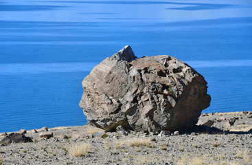 Natural geoglyph - mythical creature like the Sphinx on the shores of the sacred Tibetan lake Teri...