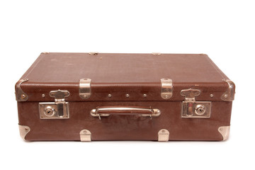Ancient suitcase for travel on a white background