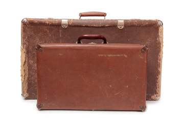 Ancient suitcase for travel on a white background