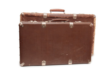 Ancient suitcase for travel on a white background