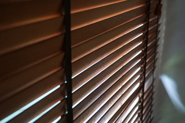 brown wood blind shade curtain and shadow