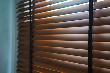 brown wood blind shade curtain and shadow