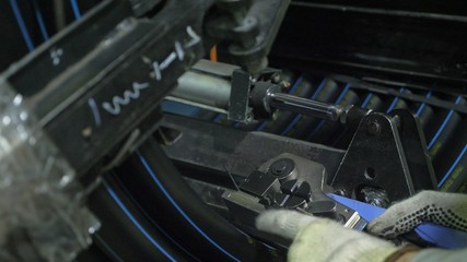 Roll threading coil pipe. Manufacture of plastic water pipes to the factory. Process of making plastic tubes on the machine tool with the use of water and air pressure.