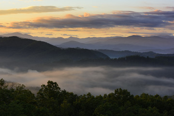 Sunrise Lighting Sky and Fog in Mountains